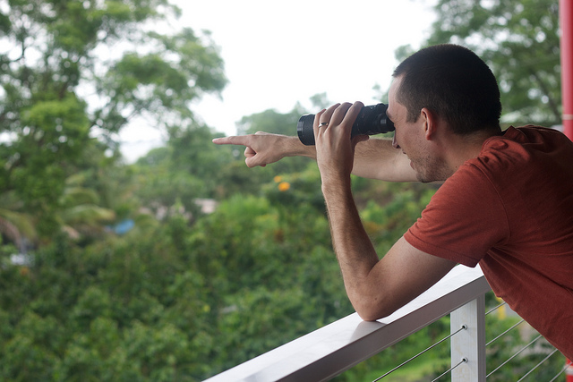 A man using binoculars